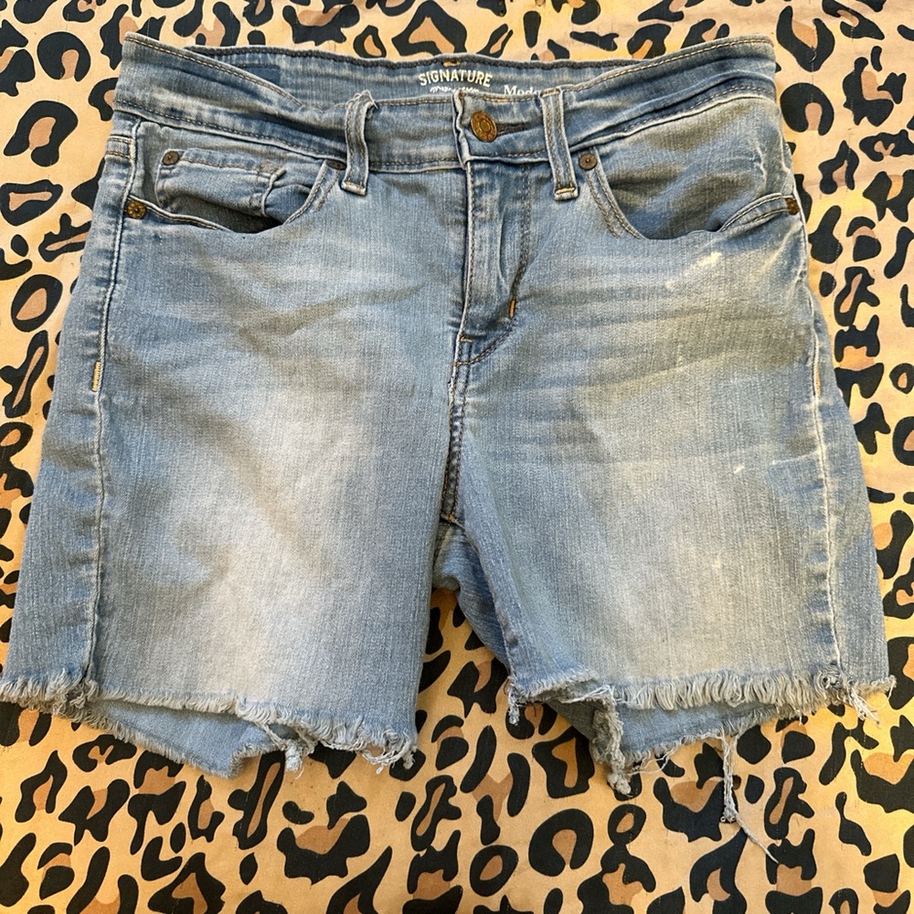 light wash blue jean shorts with frayed hem